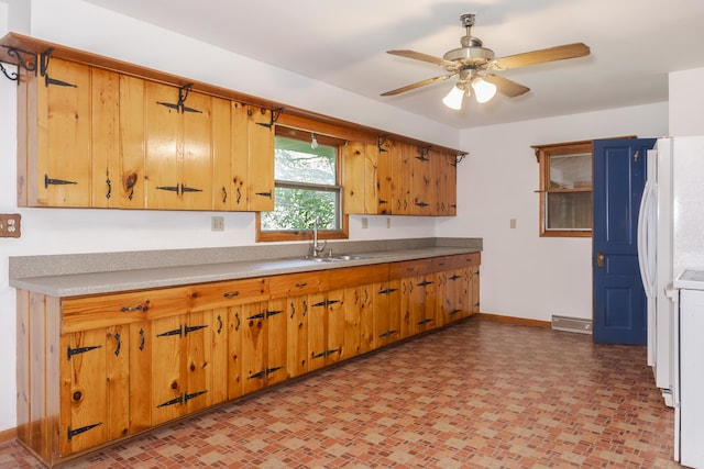 kitchen with ceiling fan and sink