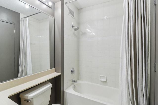 full bathroom with toilet, visible vents, and shower / tub combo with curtain