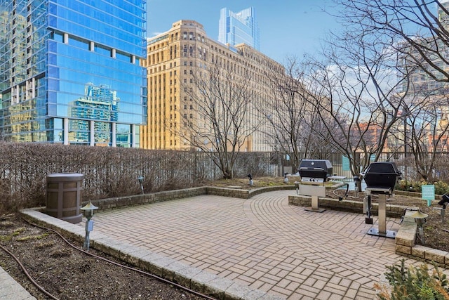 view of patio / terrace featuring area for grilling and fence