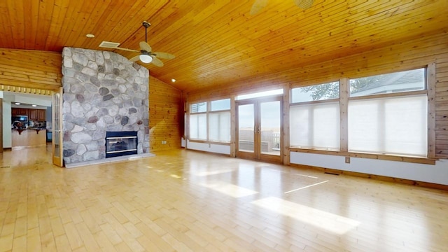 unfurnished living room with ceiling fan, wooden ceiling, lofted ceiling, and light wood-type flooring