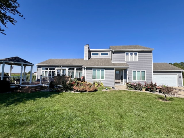 view of front of house featuring a gazebo, a front lawn, a wooden deck, and a garage