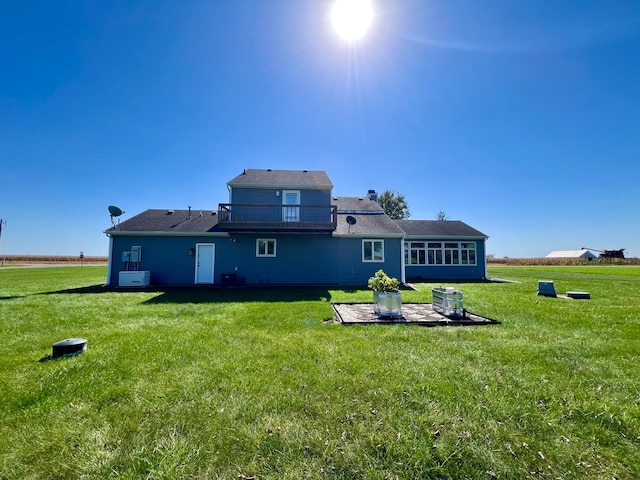 back of house featuring a yard and a patio area