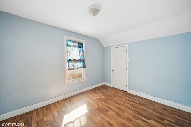 spare room with hardwood / wood-style flooring