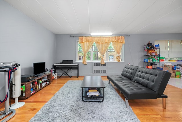 living room featuring light hardwood / wood-style flooring and radiator