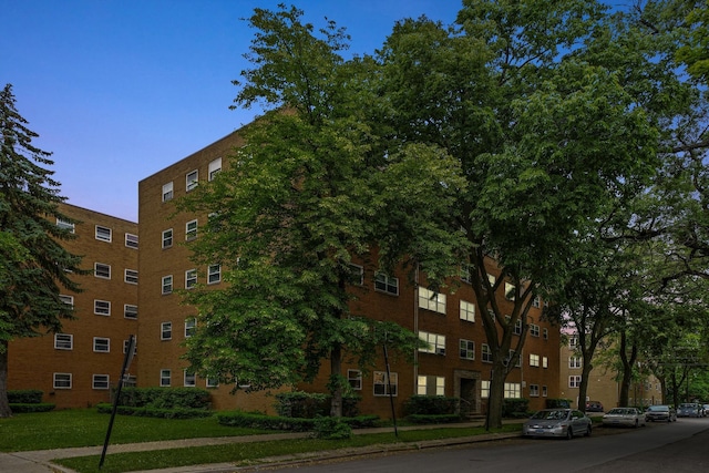 view of outdoor building at dusk