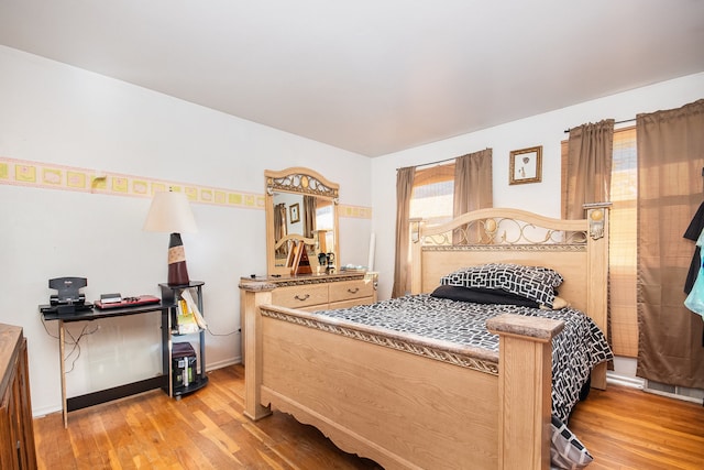 bedroom with light hardwood / wood-style floors