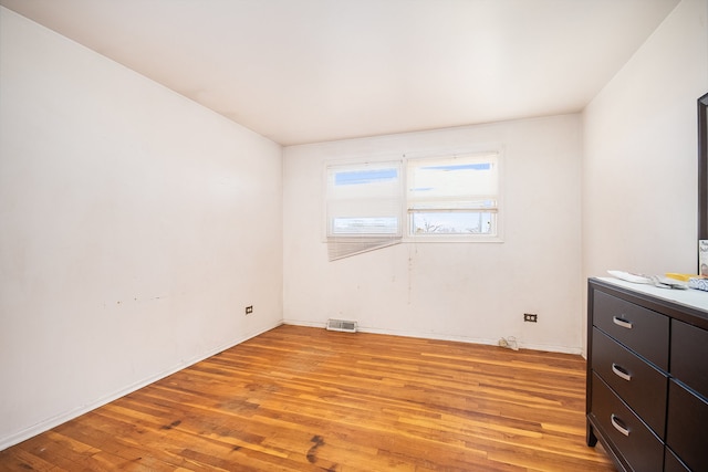 unfurnished room with light hardwood / wood-style floors