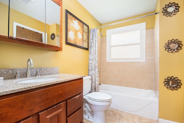 full bathroom featuring tile patterned flooring, vanity, shower / tub combo, and toilet