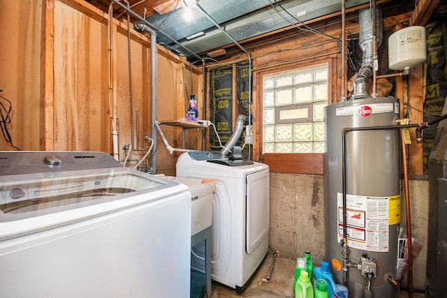 laundry area with separate washer and dryer and water heater