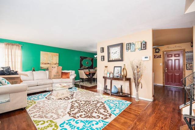 living room with dark hardwood / wood-style floors