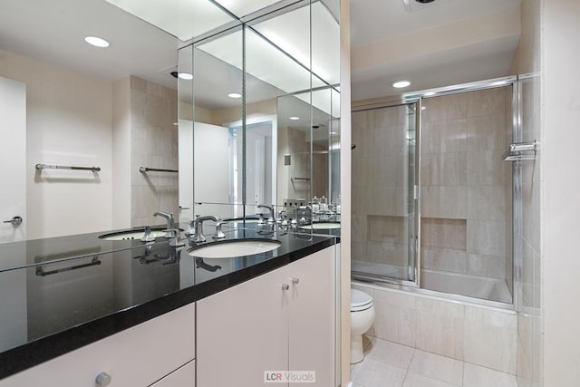 full bathroom with tiled shower / bath, toilet, recessed lighting, tile patterned flooring, and vanity