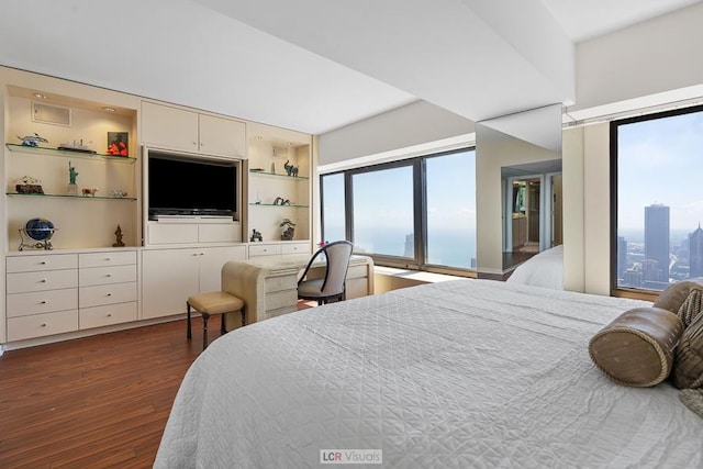 bedroom with dark wood-style floors