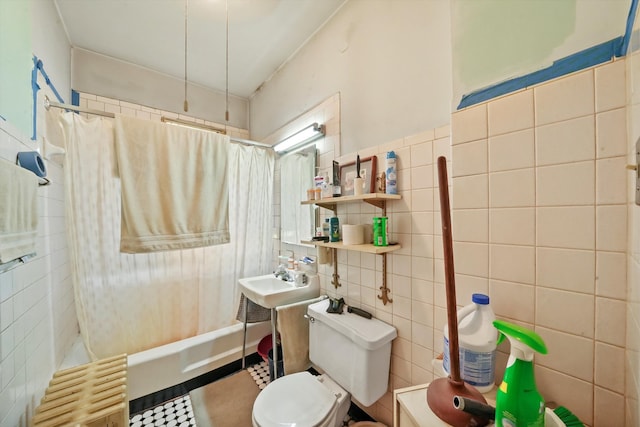 bathroom featuring tile patterned flooring, toilet, tile walls, shower / bath combination with curtain, and radiator