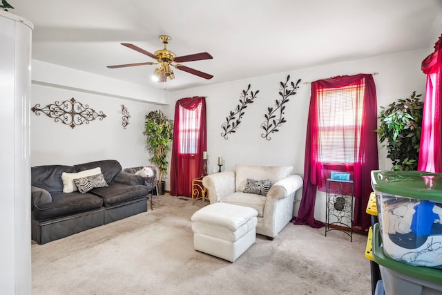 living room featuring carpet flooring and ceiling fan