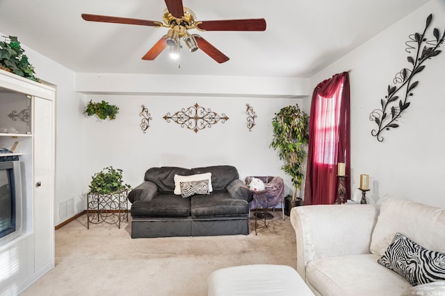 living room featuring visible vents, carpet, and ceiling fan