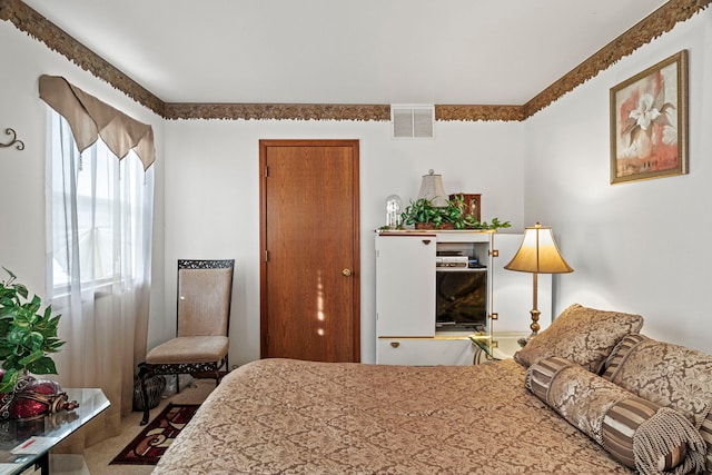 bedroom featuring visible vents