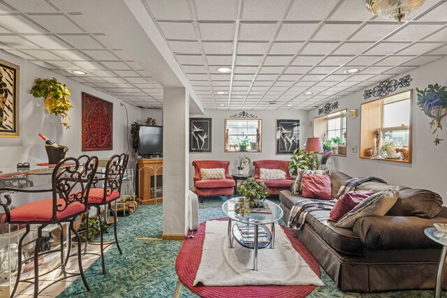 living room with recessed lighting, a paneled ceiling, and carpet floors