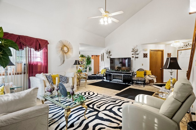 living area with carpet flooring, high vaulted ceiling, and a ceiling fan