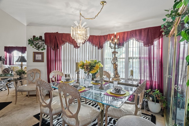 carpeted dining area with a notable chandelier