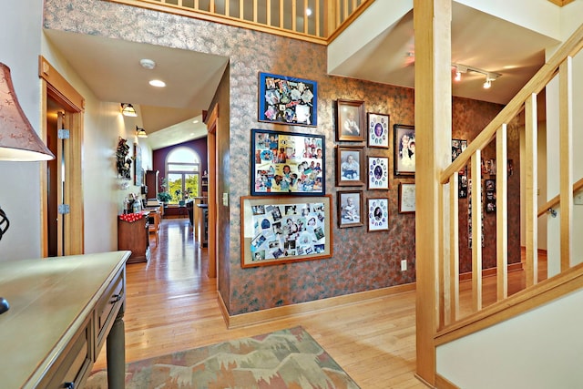 foyer featuring hardwood / wood-style flooring and rail lighting