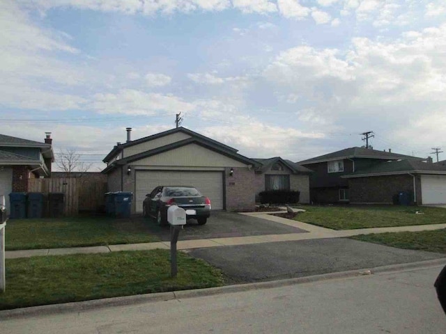 ranch-style house with a front yard and a garage