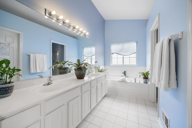 107 W Hampton Ct, Round Lake, IL 60073 - full bath featuring tile patterned floors, double vanity, and a bath