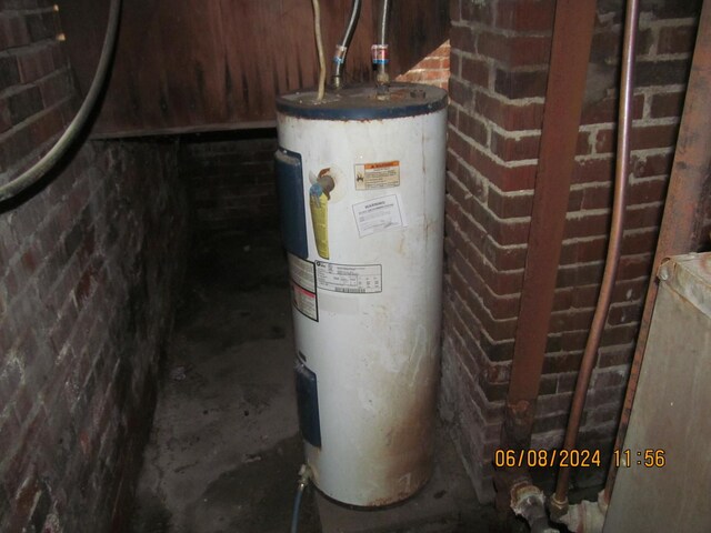 utility room with water heater