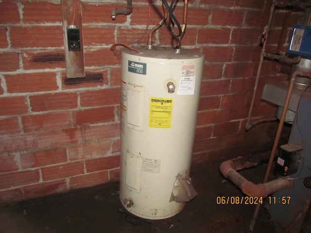 utility room featuring electric water heater