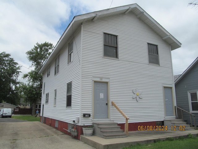 traditional-style house with entry steps