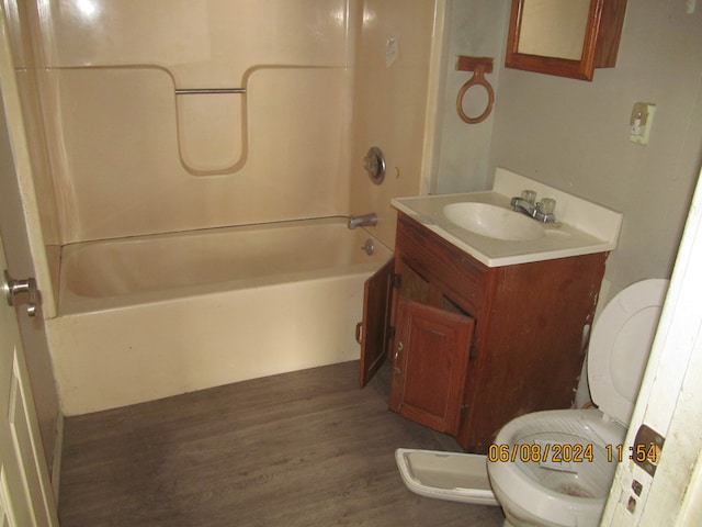 full bathroom with shower / bath combination, wood-type flooring, toilet, and vanity