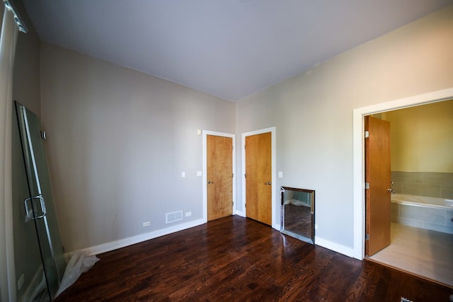 unfurnished living room featuring wood-type flooring