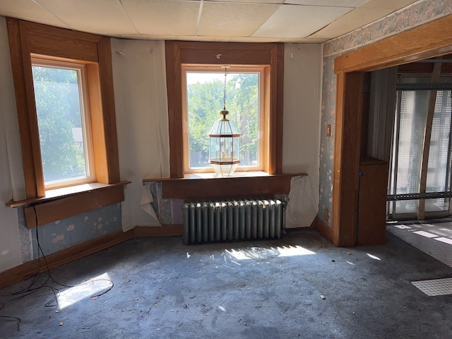 misc room featuring radiator heating unit and carpet floors