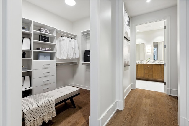 spacious closet with wood finished floors