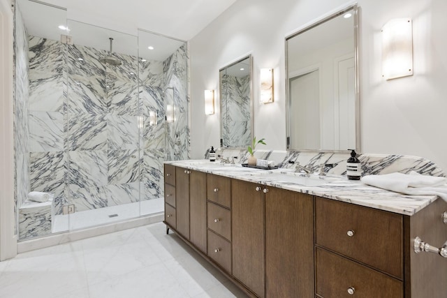 full bathroom featuring marble finish floor, a marble finish shower, double vanity, recessed lighting, and a sink