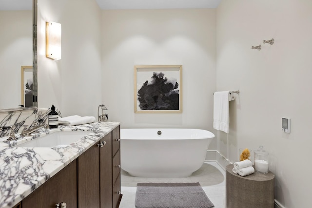 bathroom with a freestanding bath and vanity