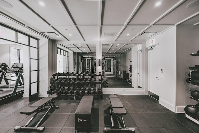 gym with visible vents, plenty of natural light, and baseboards