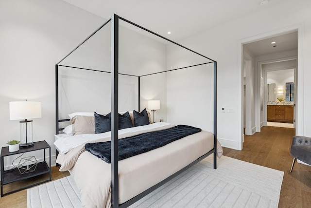 21 N May St Unit 402, Chicago, IL 60607 - bedroom with wood finished floors, baseboards, and recessed lighting