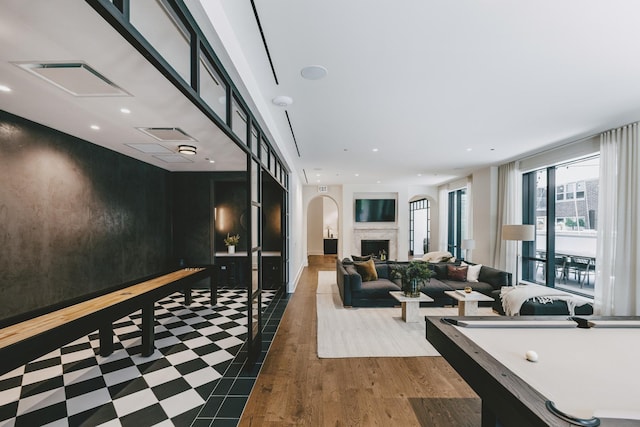 21 N May St Unit 402, Chicago, IL 60607 - game room featuring recessed lighting, a premium fireplace, and wood finished floors