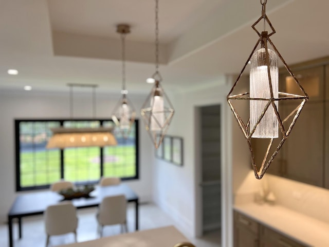 dining room with a tray ceiling