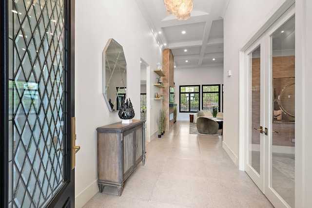 foyer with recessed lighting, coffered ceiling, a towering ceiling, baseboards, and beamed ceiling