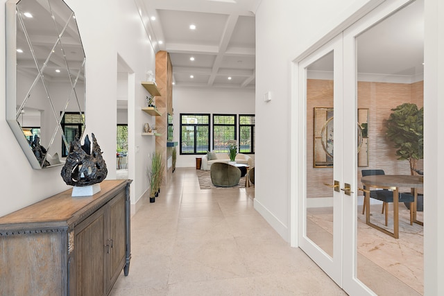 hall featuring beamed ceiling, french doors, and coffered ceiling