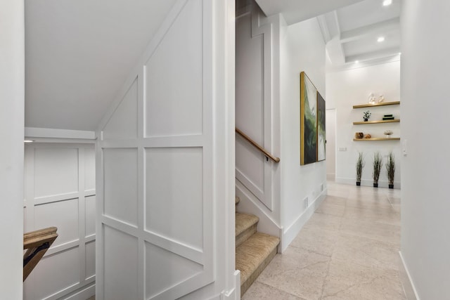 interior space with stairway, baseboards, a decorative wall, and recessed lighting