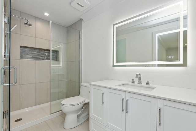 full bathroom featuring toilet, a stall shower, tile patterned flooring, and vanity