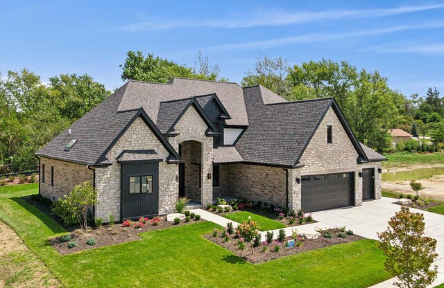 french country style house featuring a front lawn