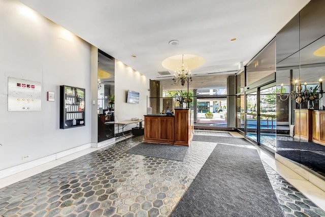 6171 N Sheridan Rd Unit 1508, Chicago, IL 60660 - reception area with a chandelier and floor to ceiling windows