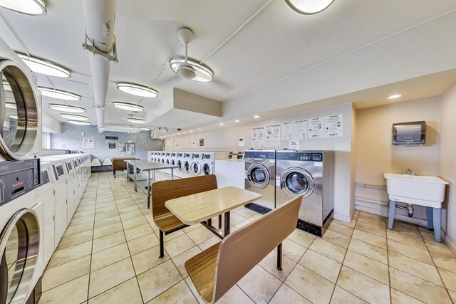 6171 N Sheridan Rd Unit 1508, Chicago, IL 60660 - shared laundry featuring independent washer and dryer, stacked washer / drying machine, light tile patterned floors, recessed lighting, and baseboards