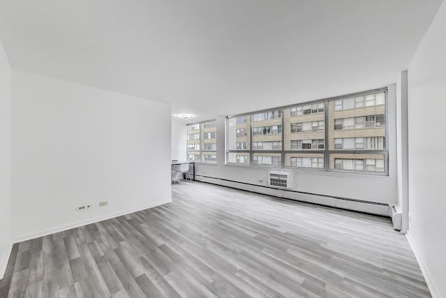 6171 N Sheridan Rd Unit 1508, Chicago, IL 60660 - unfurnished room with wood finished floors, a baseboard radiator, and baseboards