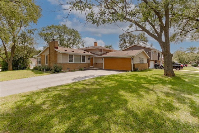 single story home with a garage and a front lawn