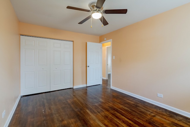 unfurnished bedroom featuring dark hardwood / wood-style flooring, a closet, and ceiling fan