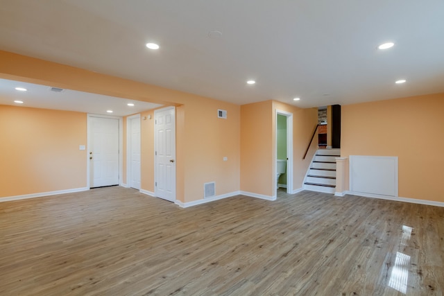 unfurnished living room featuring light hardwood / wood-style floors